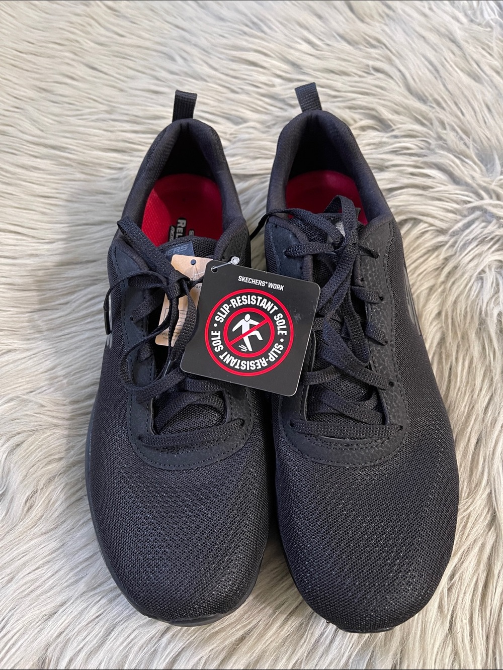 Skechers women’s Black Athletic Slip-Resistant Sneakers with‎ Red Insole Accents